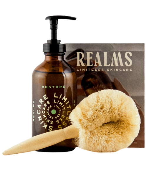 The Restore Ritual: Restore Body Oil 8 oz, a natural-bristle dry brush and the Realms ritual card